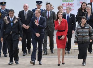 Kate Middleton in Christchurch in a red Luisa Spagnoli suit cinched in at the waist by a black belt.jpg